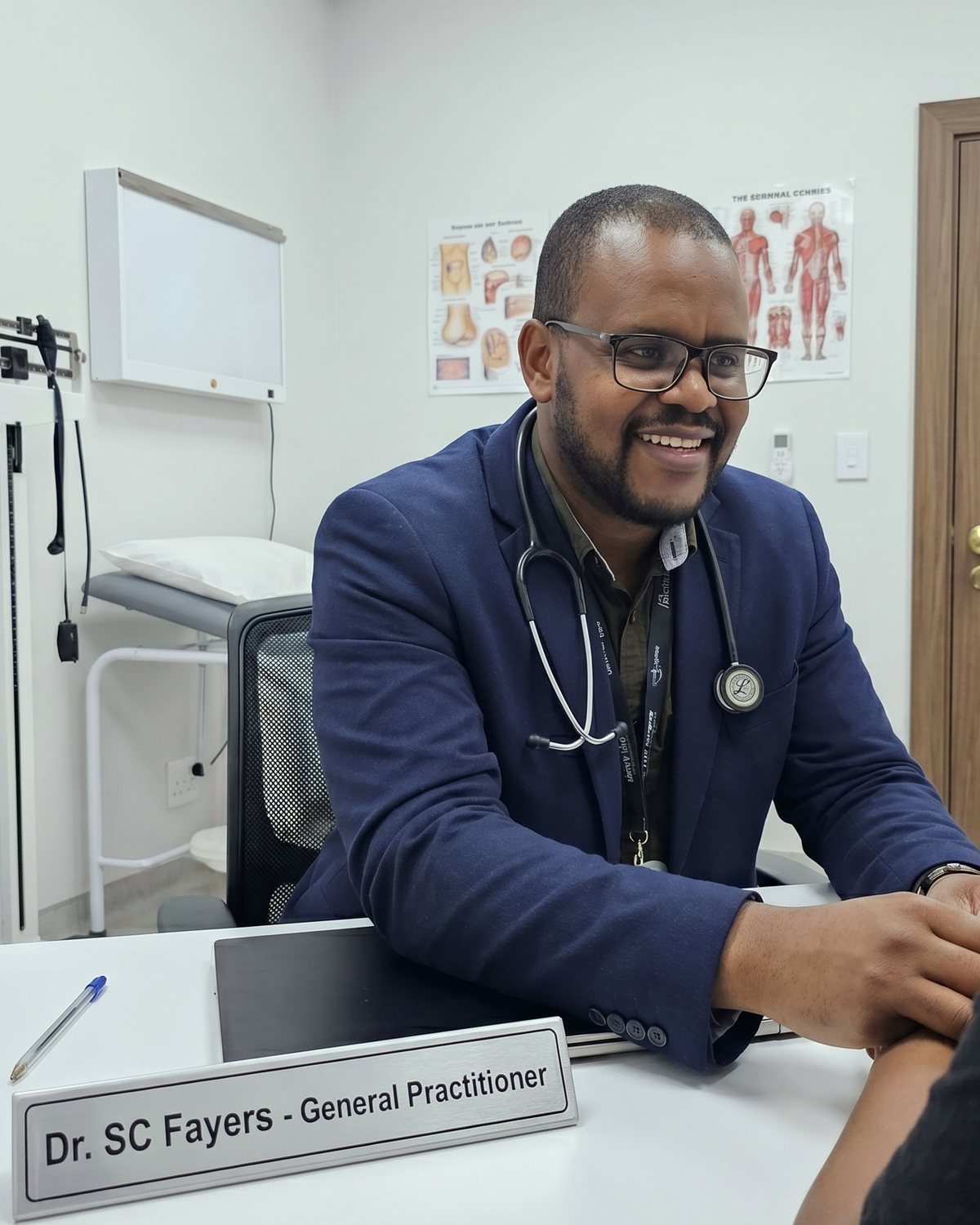 Dr Fayers in consultation with a patient